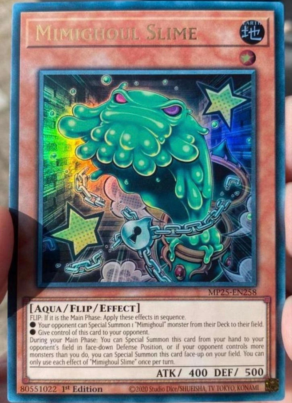 Yu-Gi-Oh! Mimighoul Slime MP25 1st Edition Tin Promo !, Ophalen of Verzenden, Zo goed als nieuw, Losse kaart, Foil