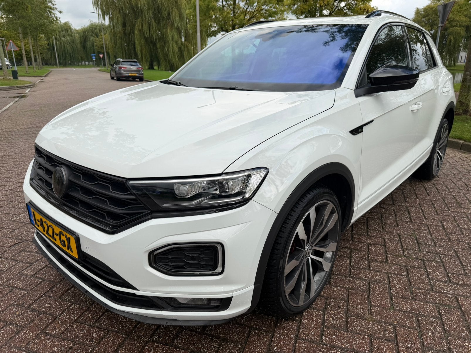Volkswagen T-Roc 1.5 TSI 150pk 7-DSG 2019 Wit, Auto's, 1498 cc, 4 cilinders, Wit, 14 km/l
