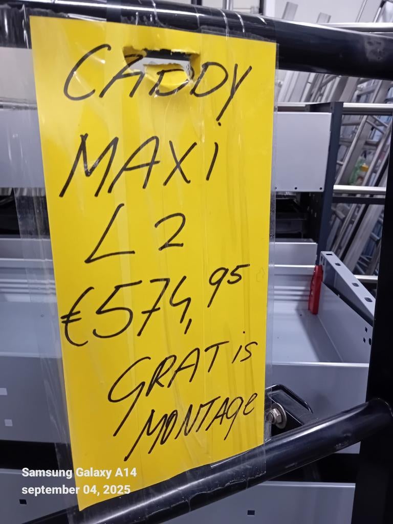 Volkswagen zwarte Caddy maxi imperiaal, Ophalen