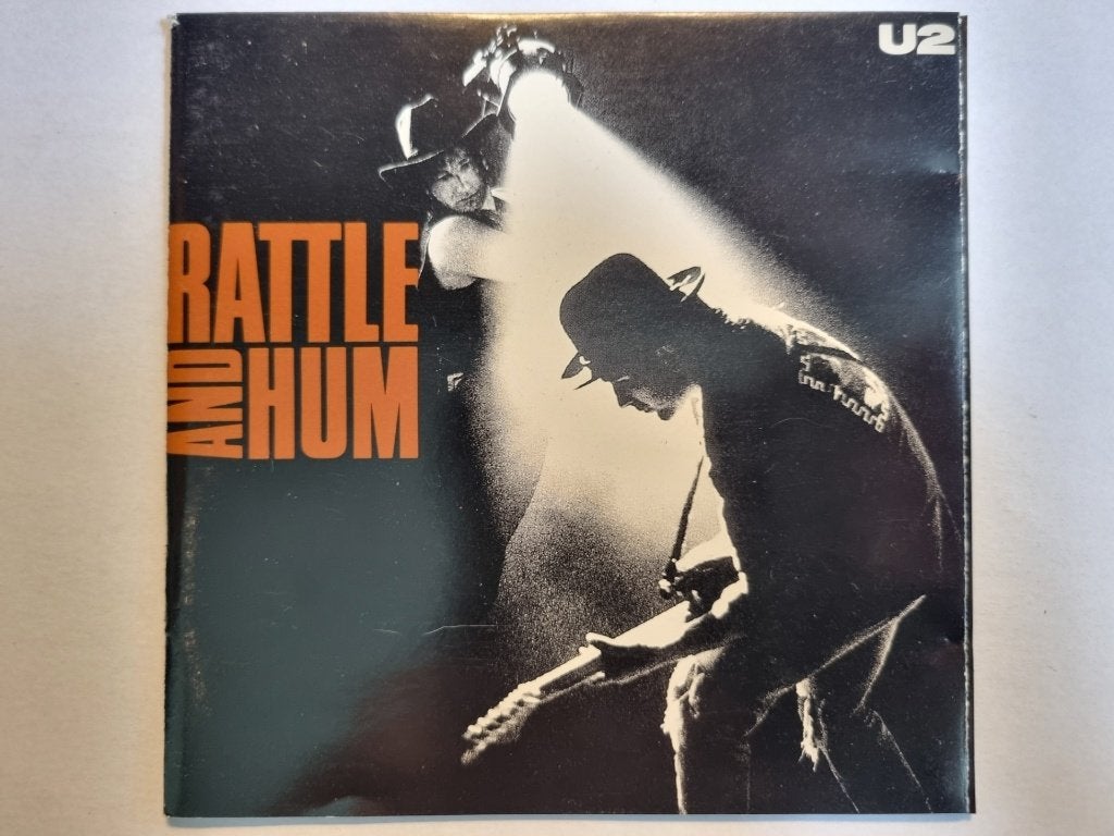 CD U2 - Rattle And Hum (1988, oa Angel Of Harlem en Desire), Inclusief boekje, Gebruikt, Ophalen of Verzenden, Poprock