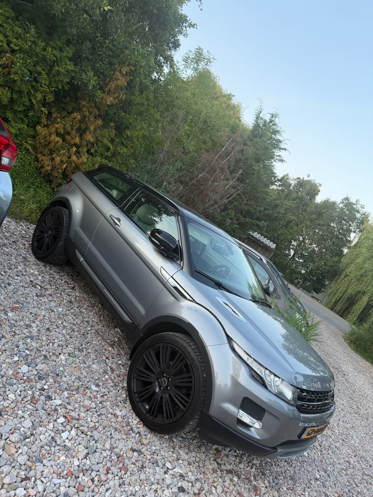 Land Rover Range Rover Evoque SI4 4WD Coupe AUT 2012 Grijs, Auto's, Land Rover, Automaat, 1800 kg, 4 cilinders, 11 km/l