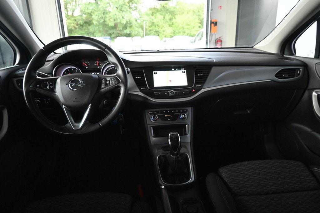 Opel Astra 1.0 Turbo 120 Jaar Edition Airco Navigatie Carpla, Auto's, Opel, Stof, Gebruikt, Met garantie (alle), 610 kg