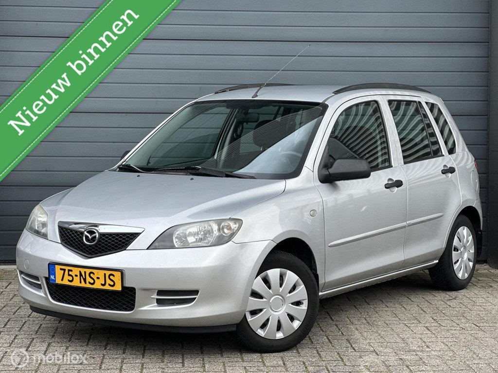 Mazda 2 1.4 Exclusive Automaat | Airco | Trekhaak |, Auto's, 4 cilinders, Origineel Nederlands, Bedrijf, 1035 kg