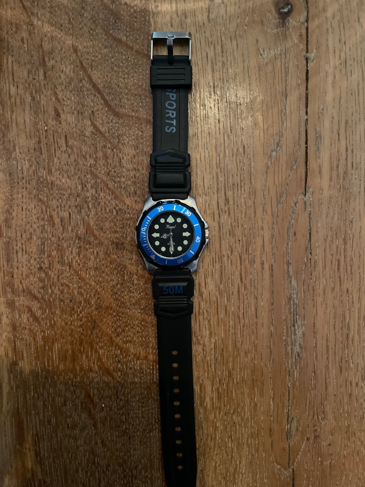 Regal Sports Polshorloge - Zwart met Blauwe Bezel, Sieraden, Tassen en Uiterlijk, Horloges | Heren, Overige merken, Gebruikt, Staal