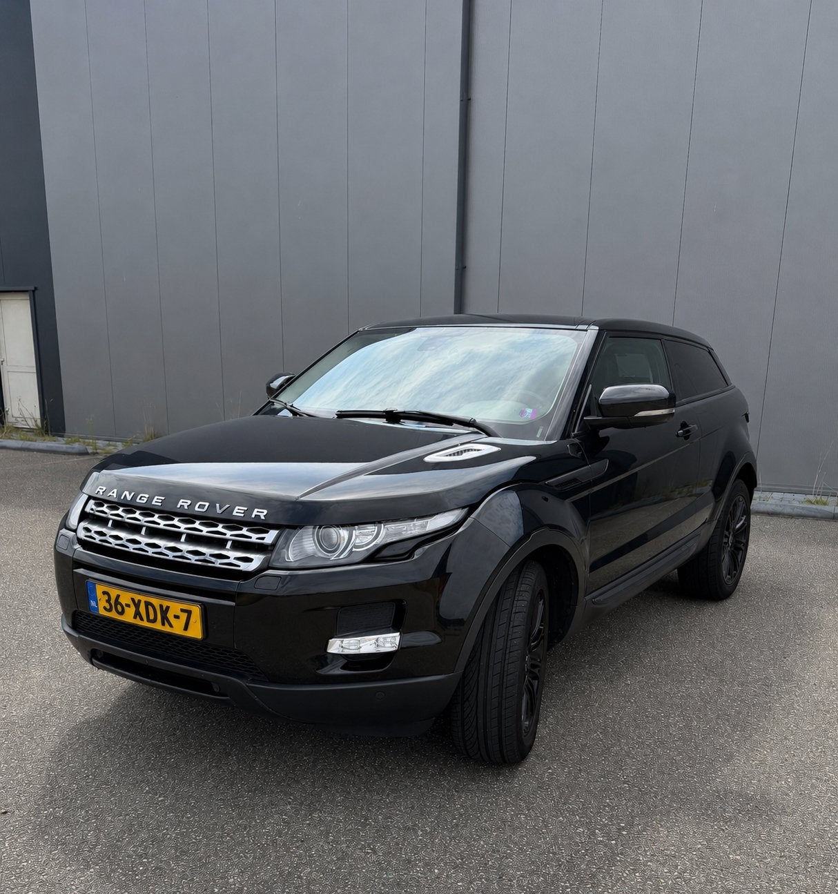 Range Rover Evoque Coupé 2.0 Si4 Prestige 4WD AUT 241 PK, Auto's, Automaat, 1800 kg, Zwart, 4 cilinders