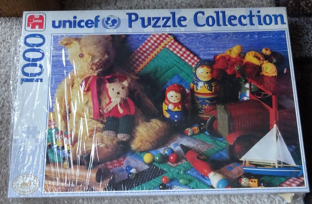 Jumbo – 1000 stukjes – Unicef - Bunte Spielzeugwelt - Nieuw, Hobby en Vrije tijd, Ophalen of Verzenden, 500 t/m 1500 stukjes, Nieuw