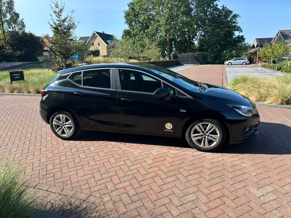 Opel Astra 1.4 Turbo 110KW 5D 2017 Zwart, Auto's, Opel, Stof, 4 cilinders, 620 kg, Zwart