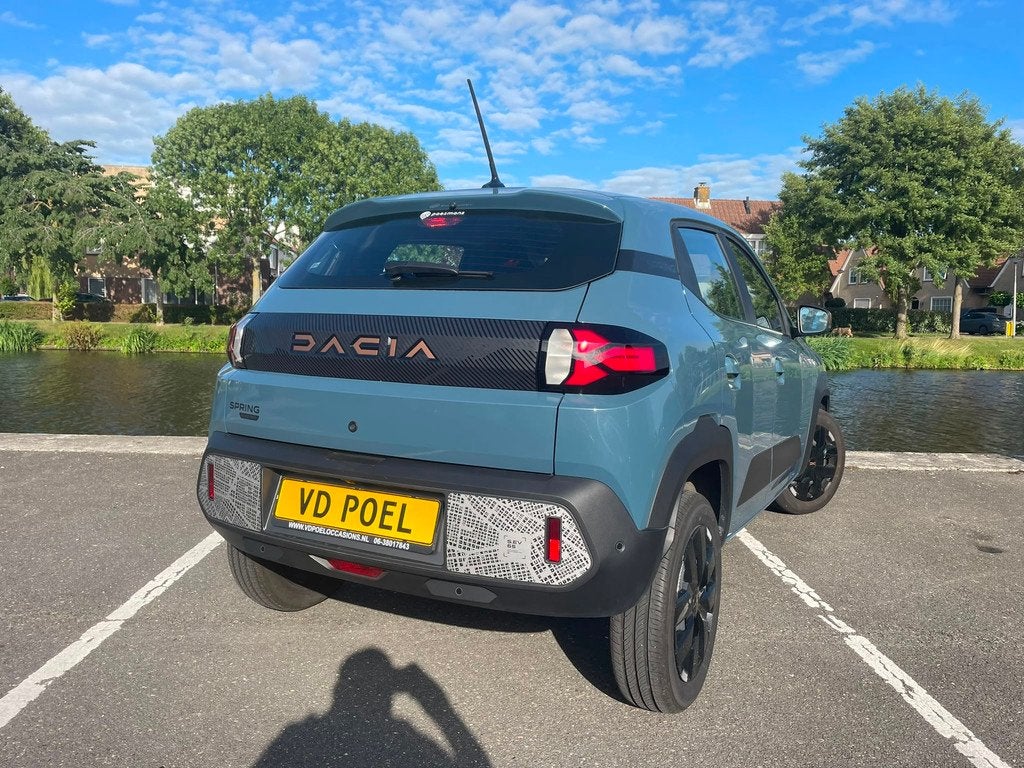 Dacia Spring Extreme 65 26.8 kWh NIEUWSTAAT NAVI AIRCO PDC, Auto's, Dacia, Gebruikt, Leder en Stof, Origineel Nederlands, 949 kg