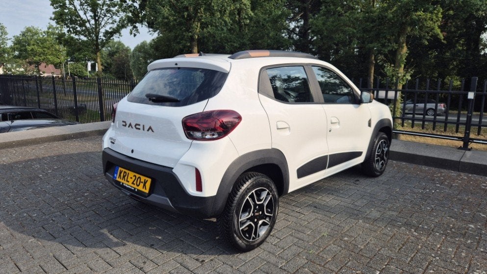 Dacia Spring Extreme 27 kWh | Camera | Navi | PDC | Lichtmet, Auto's, Dacia, Stof, Gebruikt, Huisgarantie, Met garantie (alle)