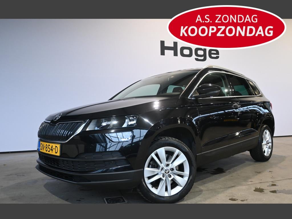 Skoda Karoq 1.0 TSI Ambition Business Clima Navigatie Cruise, Voorwielaandrijving, Stof, Gebruikt, Met garantie (alle)