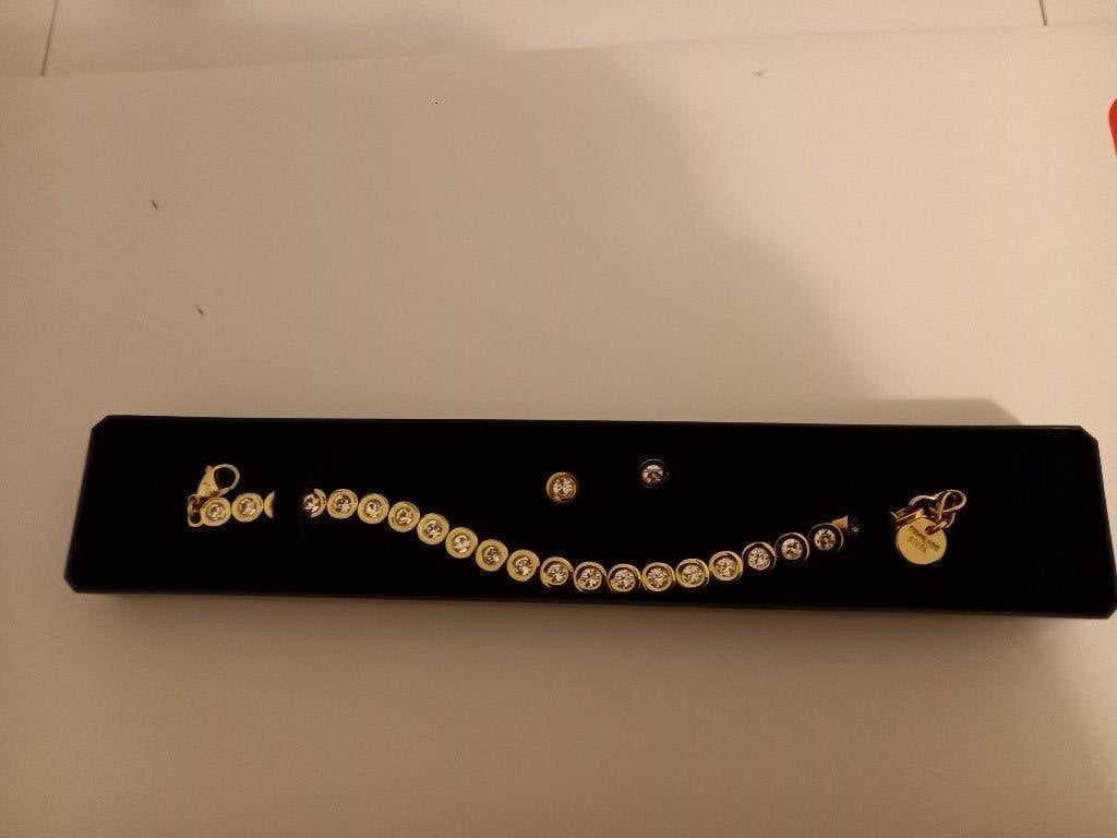 armband en oorbellen double nieuw, Overige materialen, Nieuw, Ophalen of Verzenden, Goud