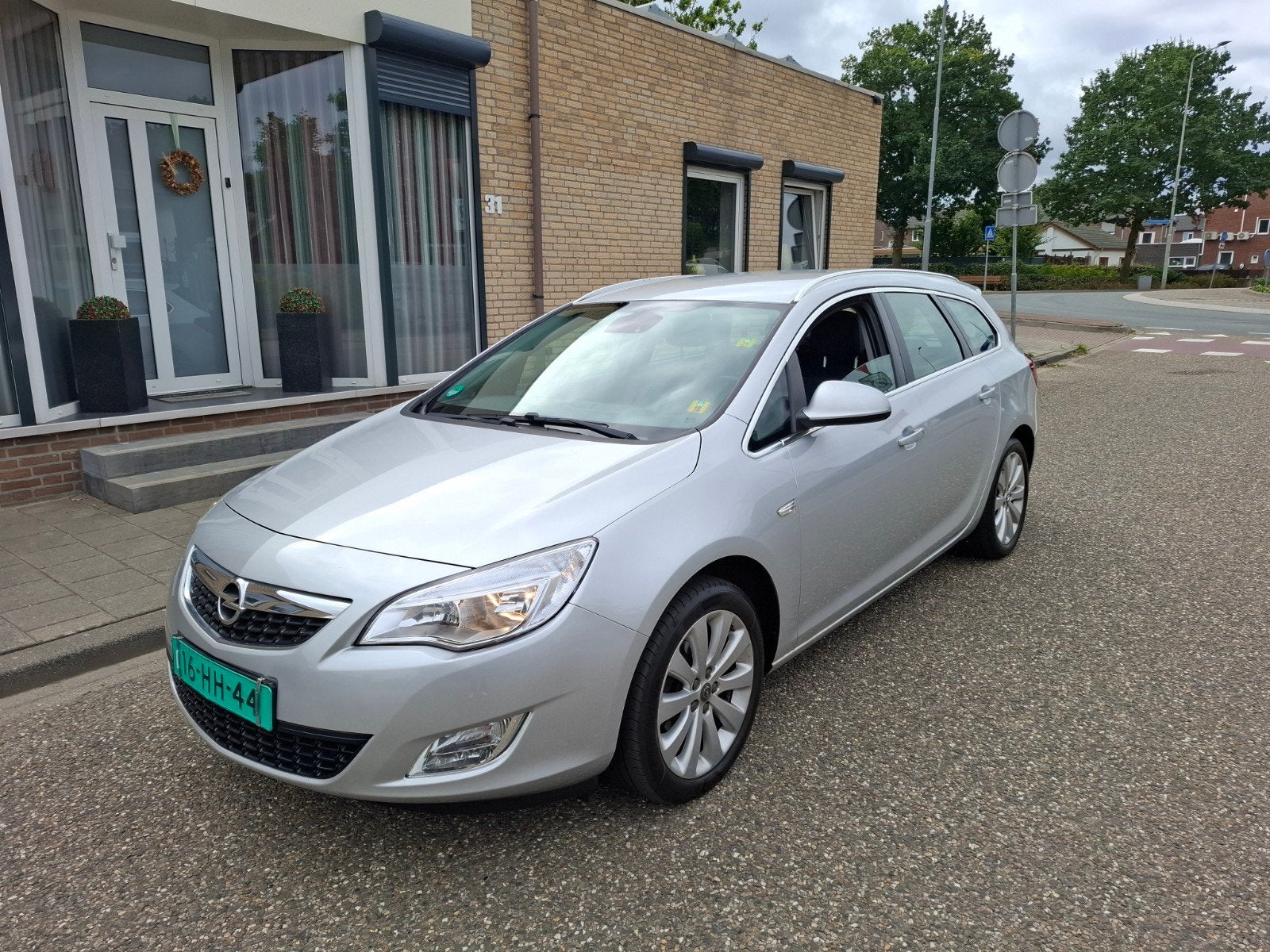 Opel Astra 1.4 74KW Sports Tourer 2011 Grijs, Auto's, Voorwielaandrijving, 4 cilinders, 100 pk, Origineel Nederlands