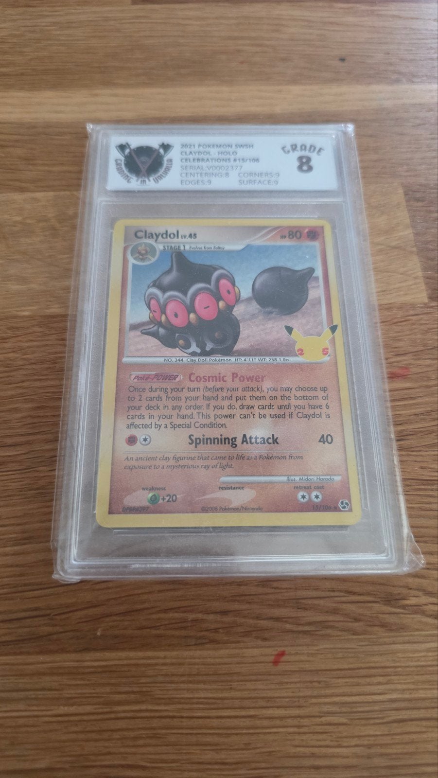 Pokemon Claydol Holo SWSH Celebrations 2021 Graded 8, Ophalen of Verzenden, Zo goed als nieuw, Losse kaart, Foil