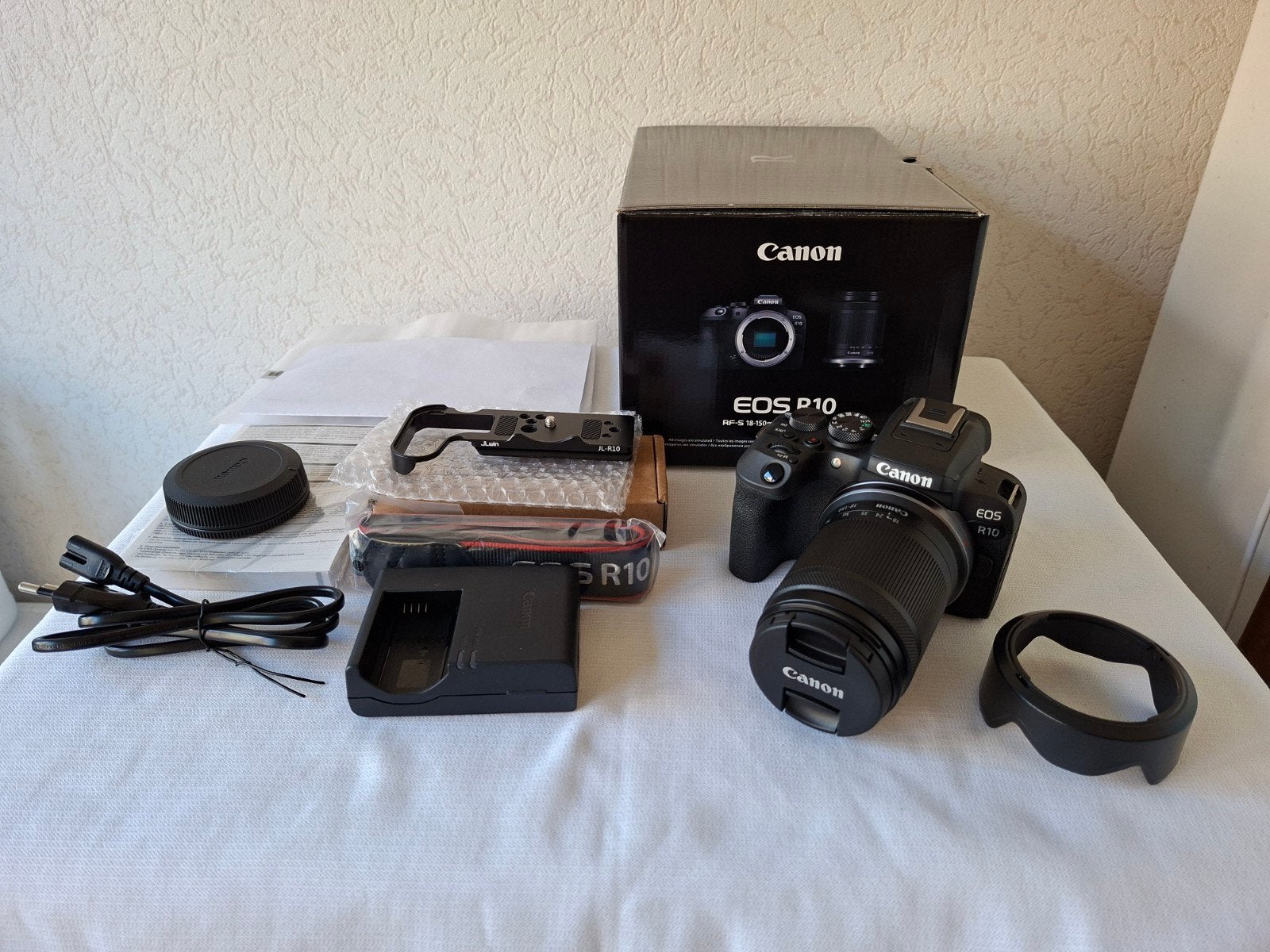 Canon EOS R10 + 18-150 is stm nieuw staat bon 22-04-2026, Ophalen of Verzenden, Zo goed als nieuw, Canon