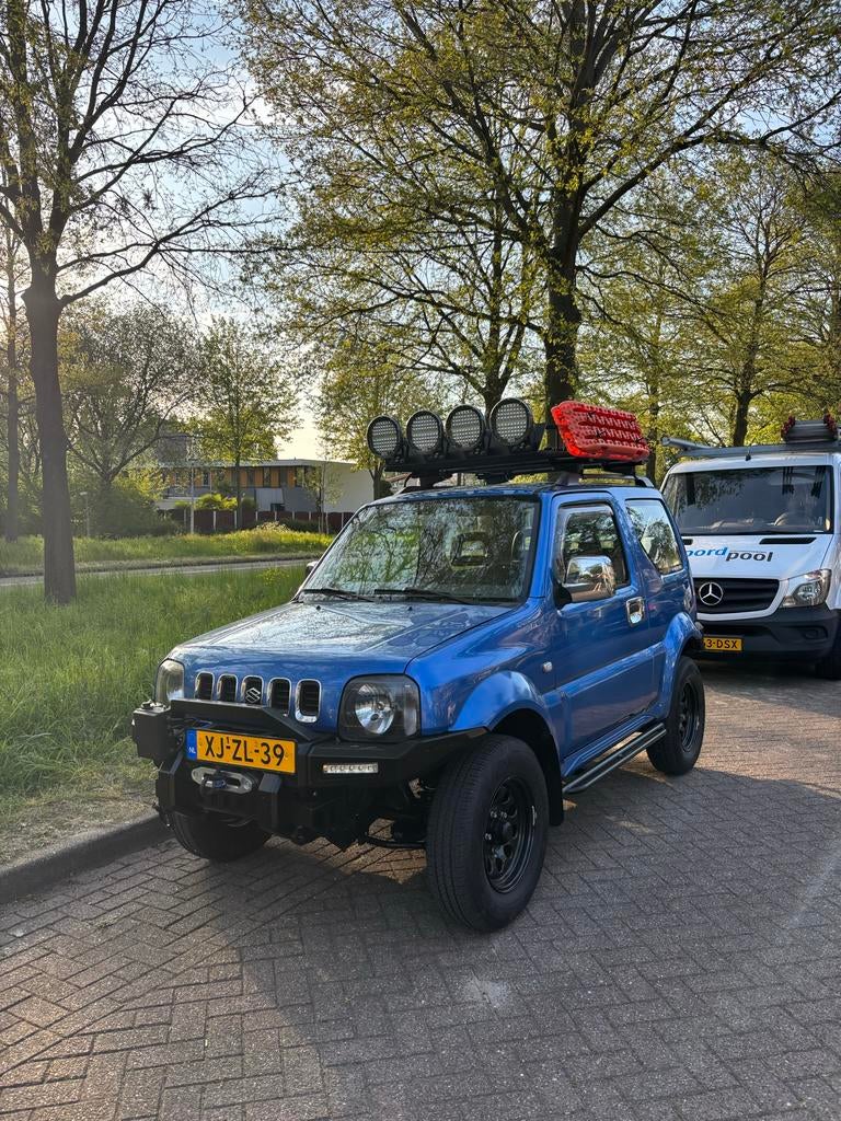 Suzuki Jimny 1.3 JX 4WD 1999 Blauw NAP, Auto's, Suzuki, Stof, 40 €/maand, 4 cilinders, USB