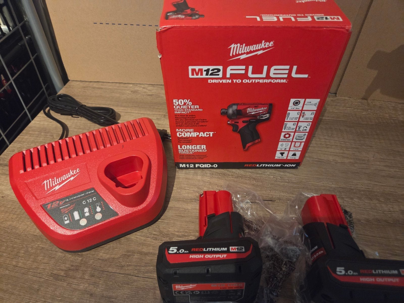 Milwaukee M12 FUEL Slagmoersleutel met 2x 5.0Ah accu's en la, Ophalen of Verzenden, Nieuw, Boor- en Schroefmachine