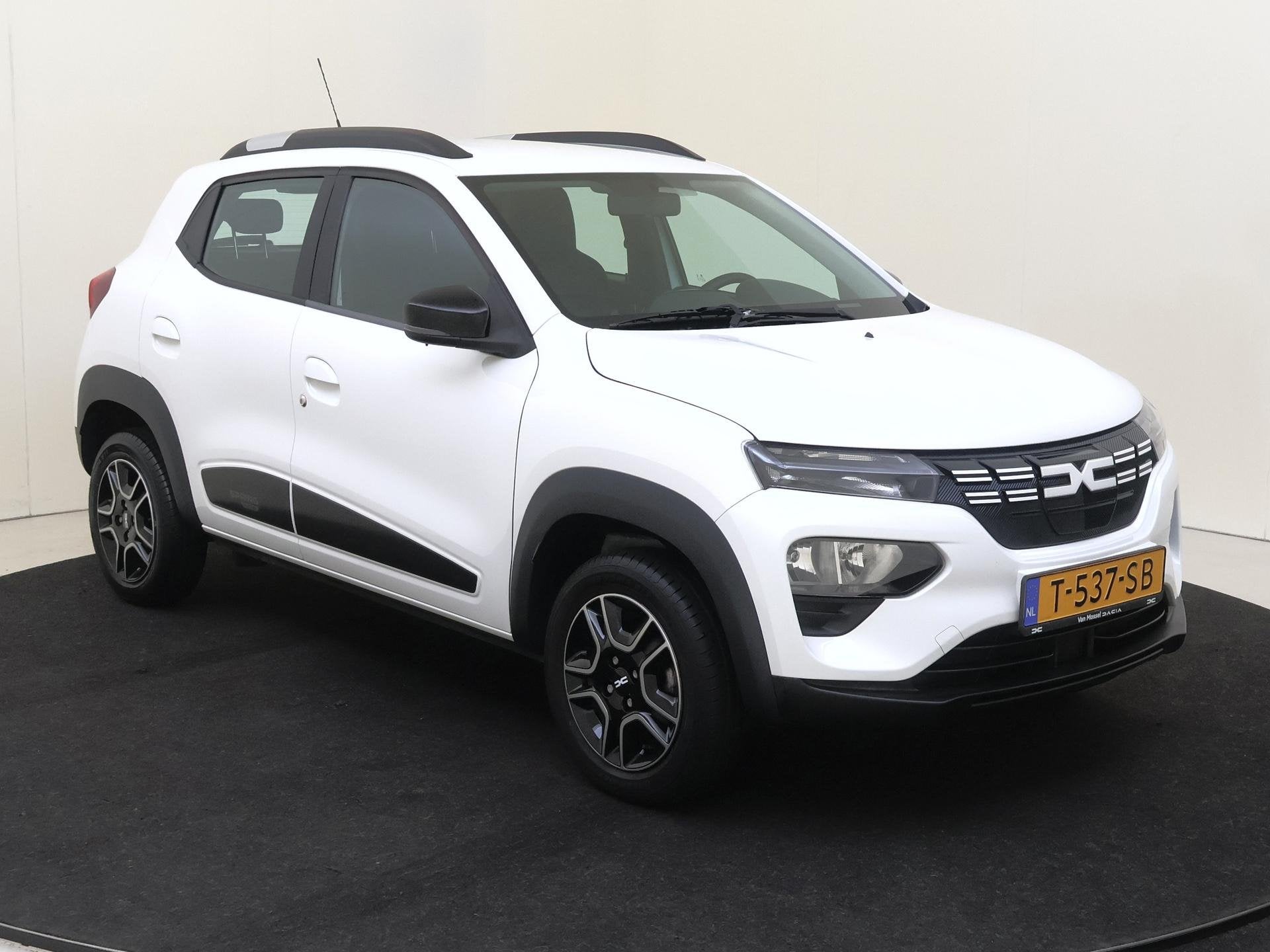 Dacia Spring Essential 27 kWh 23dkm / Airco, Auto's, Gebruikt, Leder en Stof, Wit, Elektrische ramen