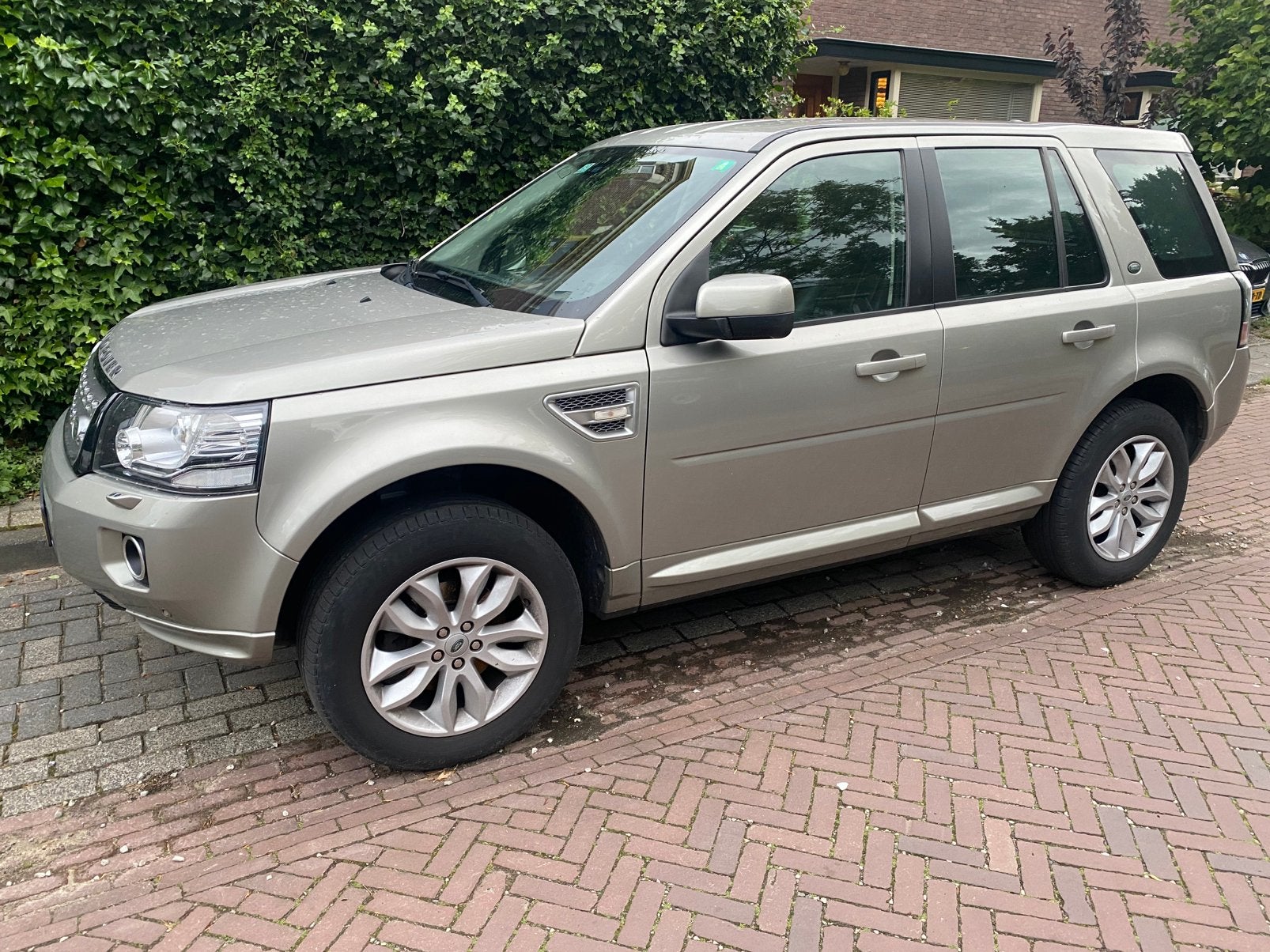 Land Rover Freelander 2.0 SI4 4WD AUT 2013, Auto's, Land Rover, Automaat, Zwart, Beige, Vierwielaandrijving
