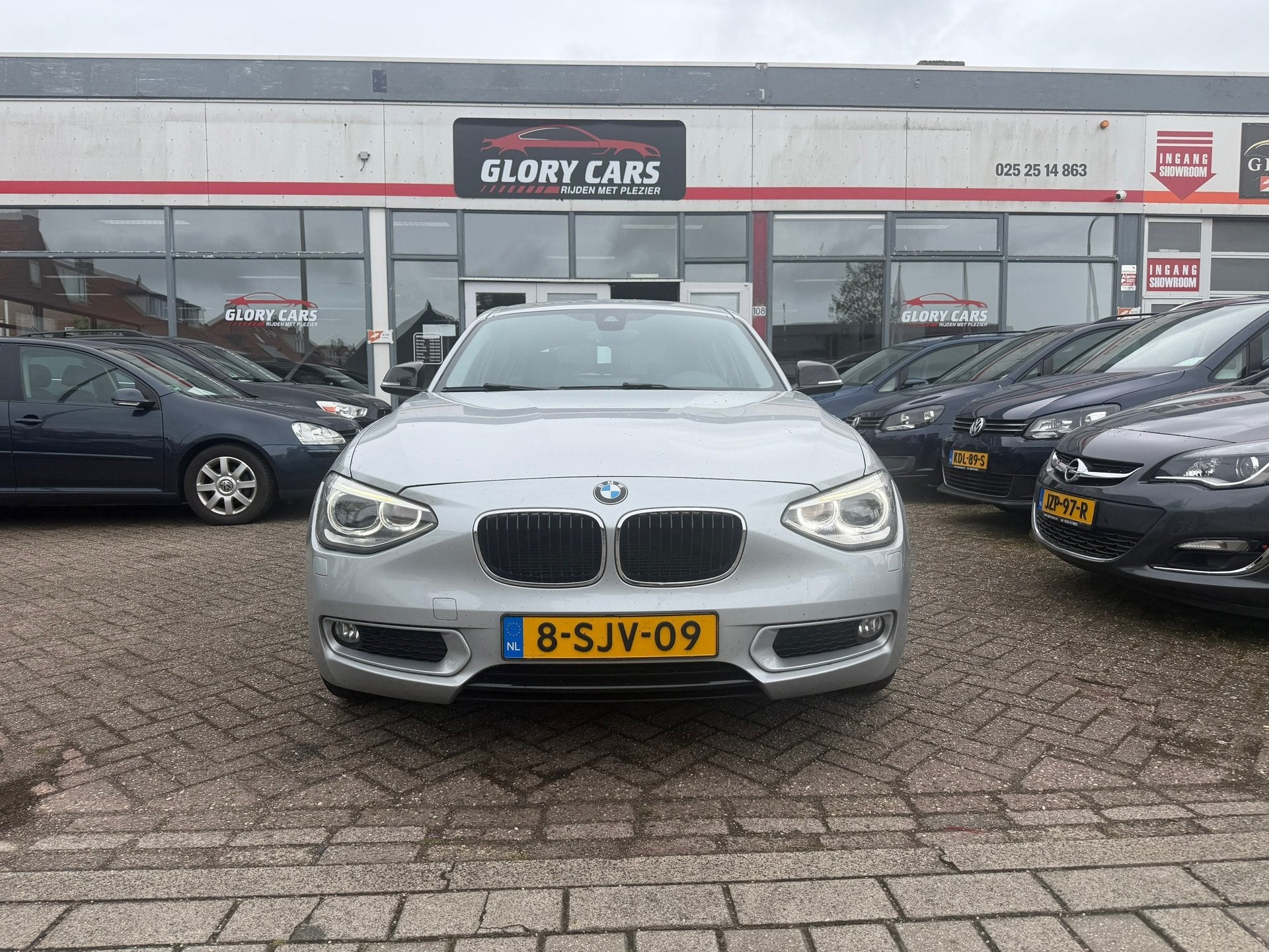 BMW 1-serie 116i Business AUTOMAAT-NAVI-CRUISE-PDC, Auto's, Euro 5, Gebruikt, Zwart, 4 cilinders