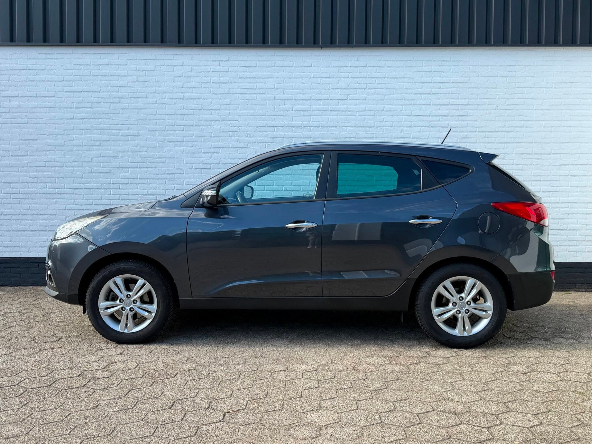 Hyundai Ix35 2.0i Style l CRUISE l CAMERA l TREKHAAK l NAP!, Auto's, Gebruikt, Zwart, 4 cilinders, Leder en Stof