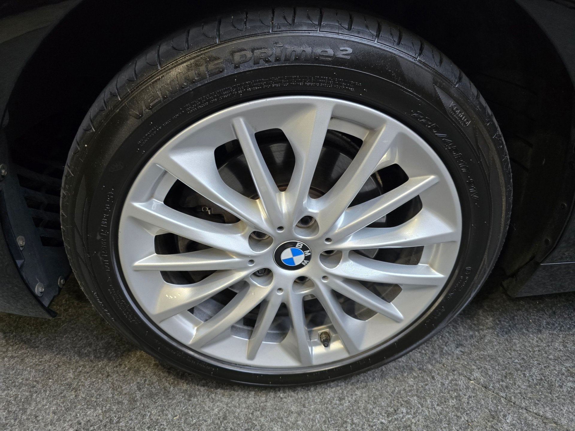 BMW 1-serie 118i High Executive Pano Clima Camera HUD Navi L, Auto's, Stof, Gebruikt, Bedrijf, 3 cilinders