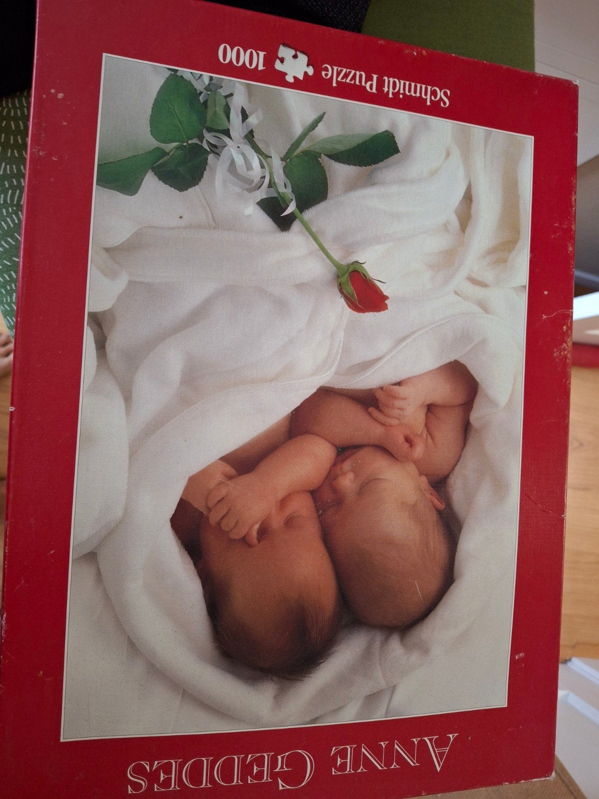 Schmidt Puzzel Anne Geddes - Baby's met roos - 1000 stukjes, Ophalen of Verzenden