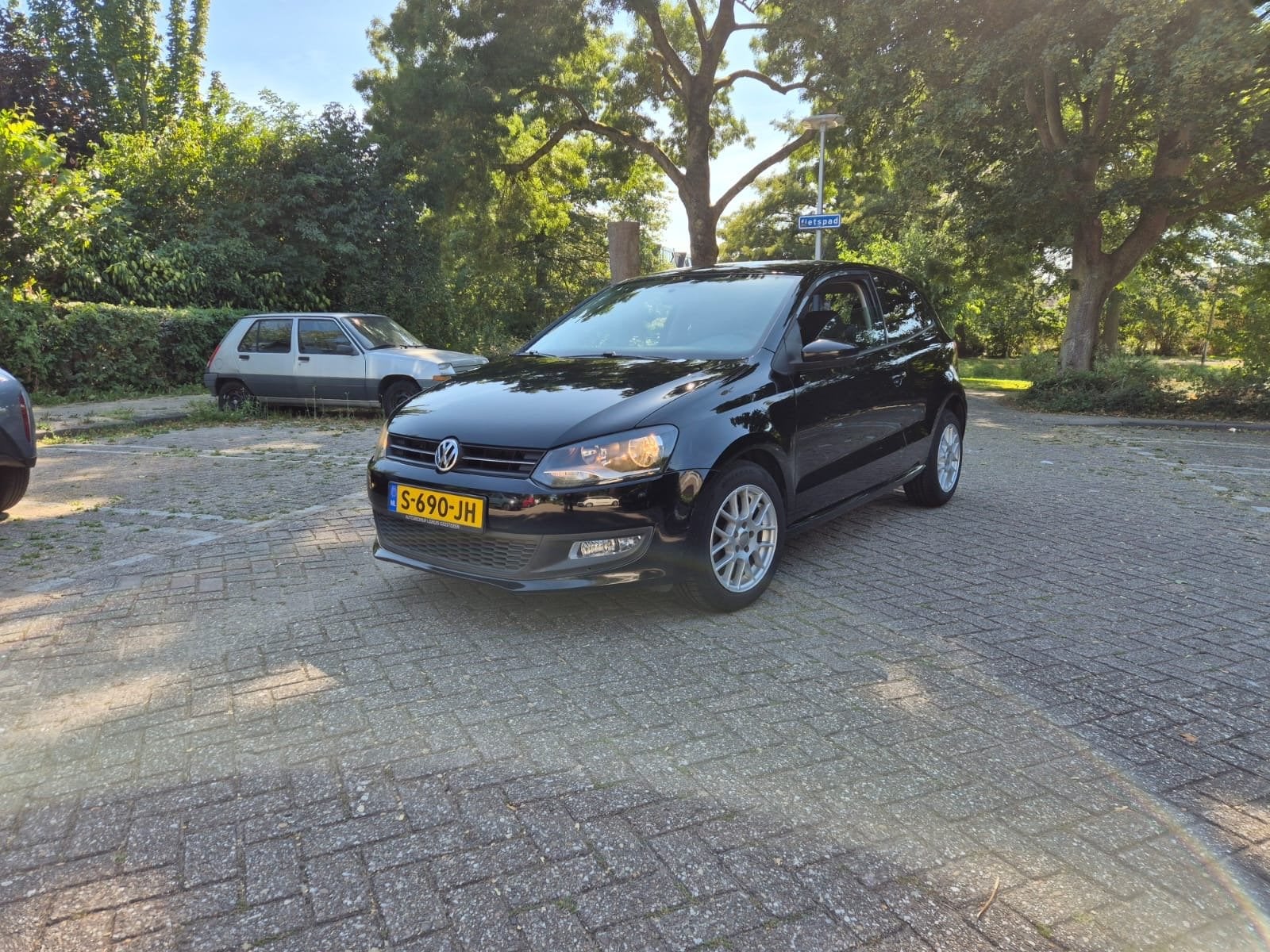 Volkswagen Polo 1.2 TSI 77KW 2011 Zwart, Voorwielaandrijving, Euro 5, Stof, 40 €/maand