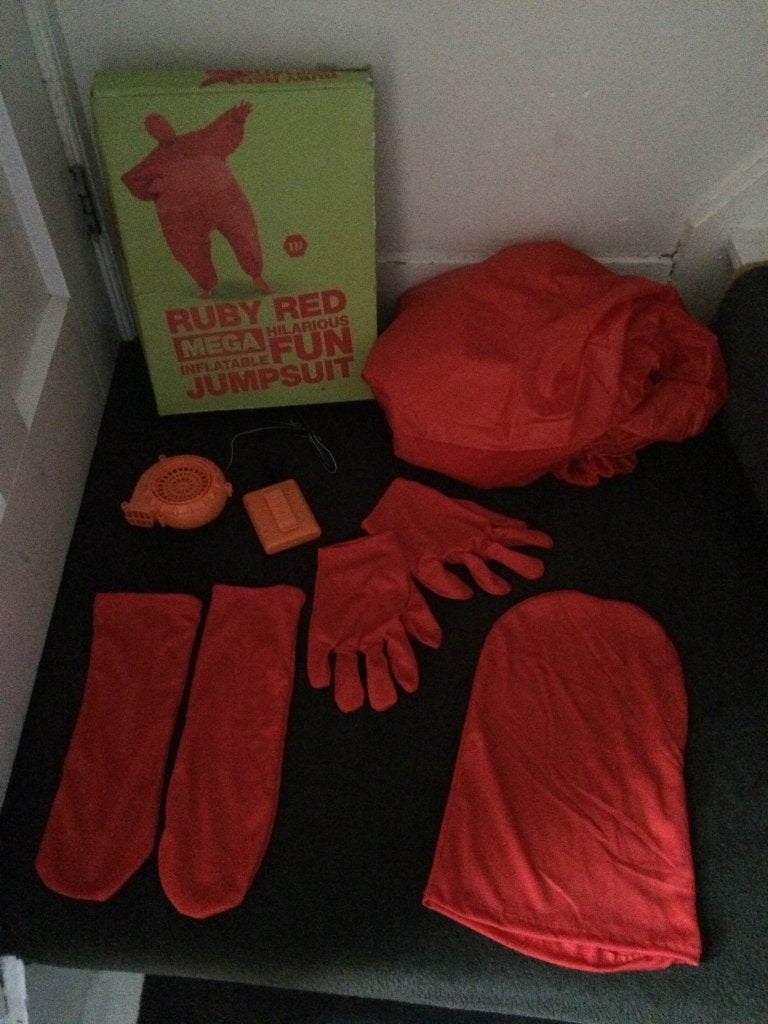 Ruby mega inflatable jumpsuit red - dames of heren ZGAN!, Maat 42/44 (L), Ophalen of Verzenden, Overige thema's, Zo goed als nieuw