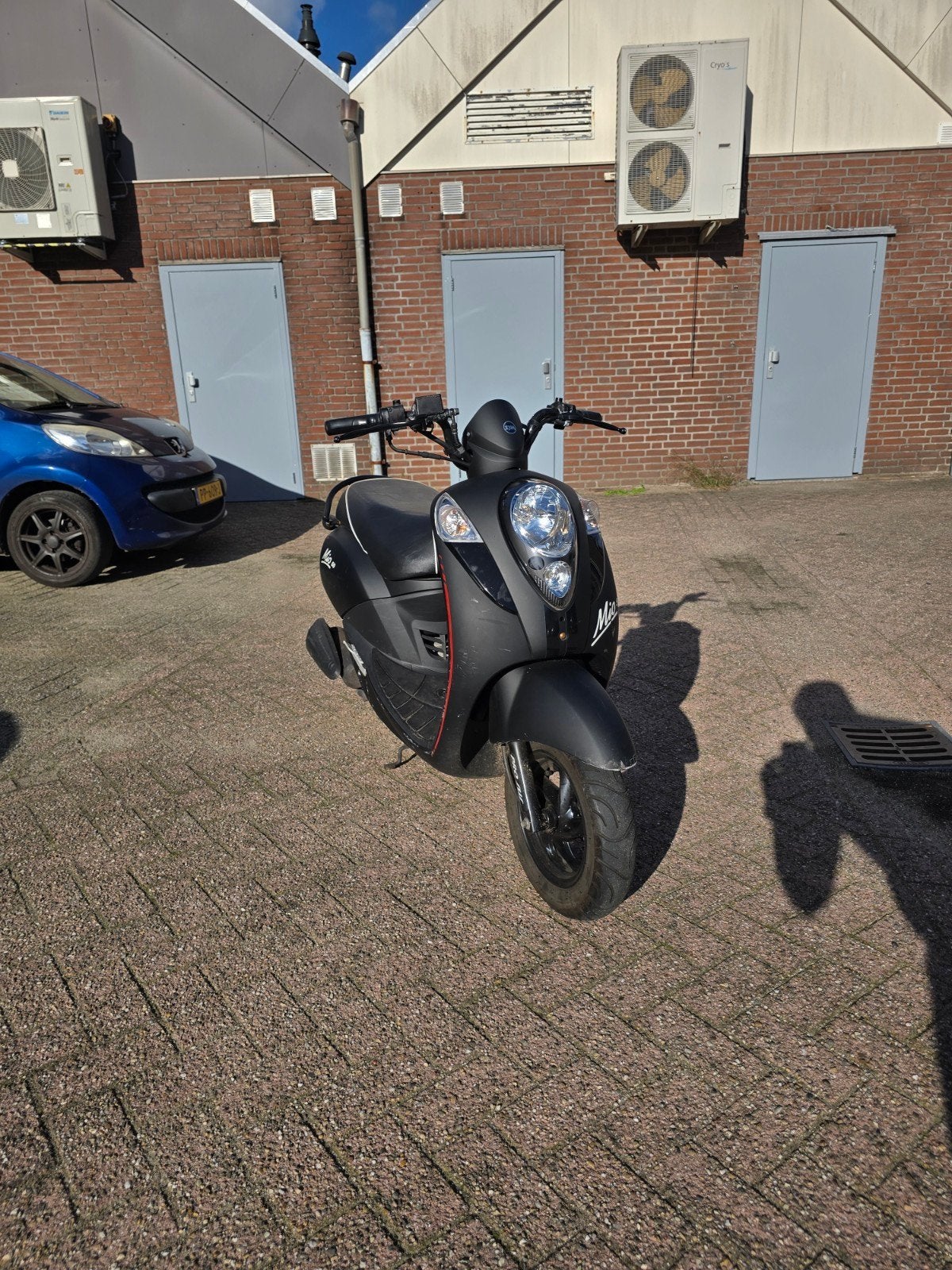 sym mio 50 geel kenteken, Ophalen