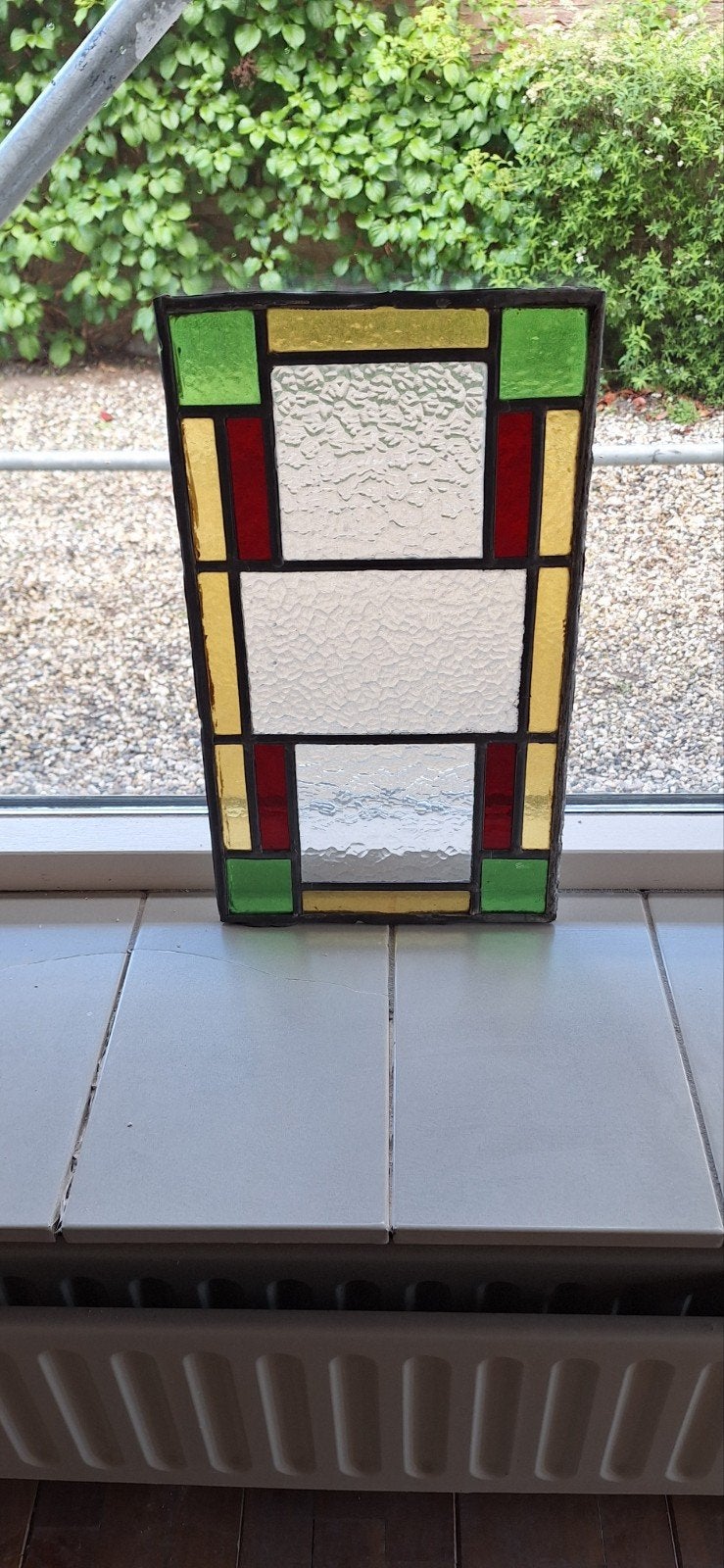 Glas in lood.
27cmx46cm, Ophalen