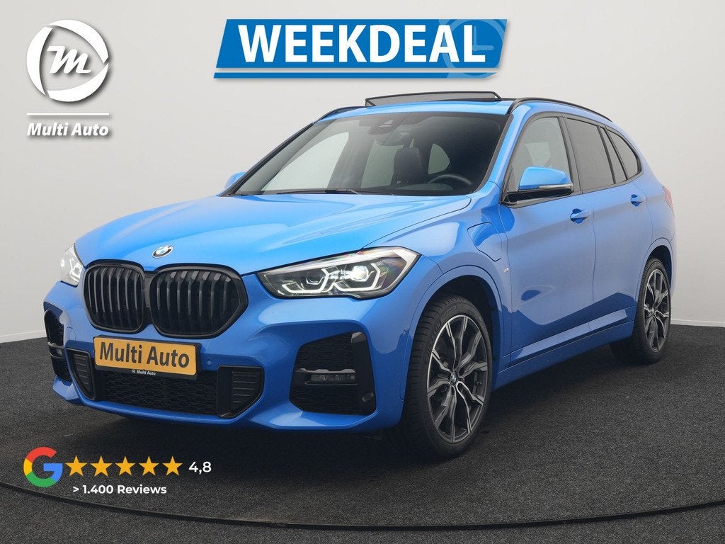 BMW X1 xDrive25e M Sport PHEV 221pk Dealer O.H | Trekhaak Af, Auto's, BMW, Gebruikt, Blauw, Leder en Stof, Bedrijf