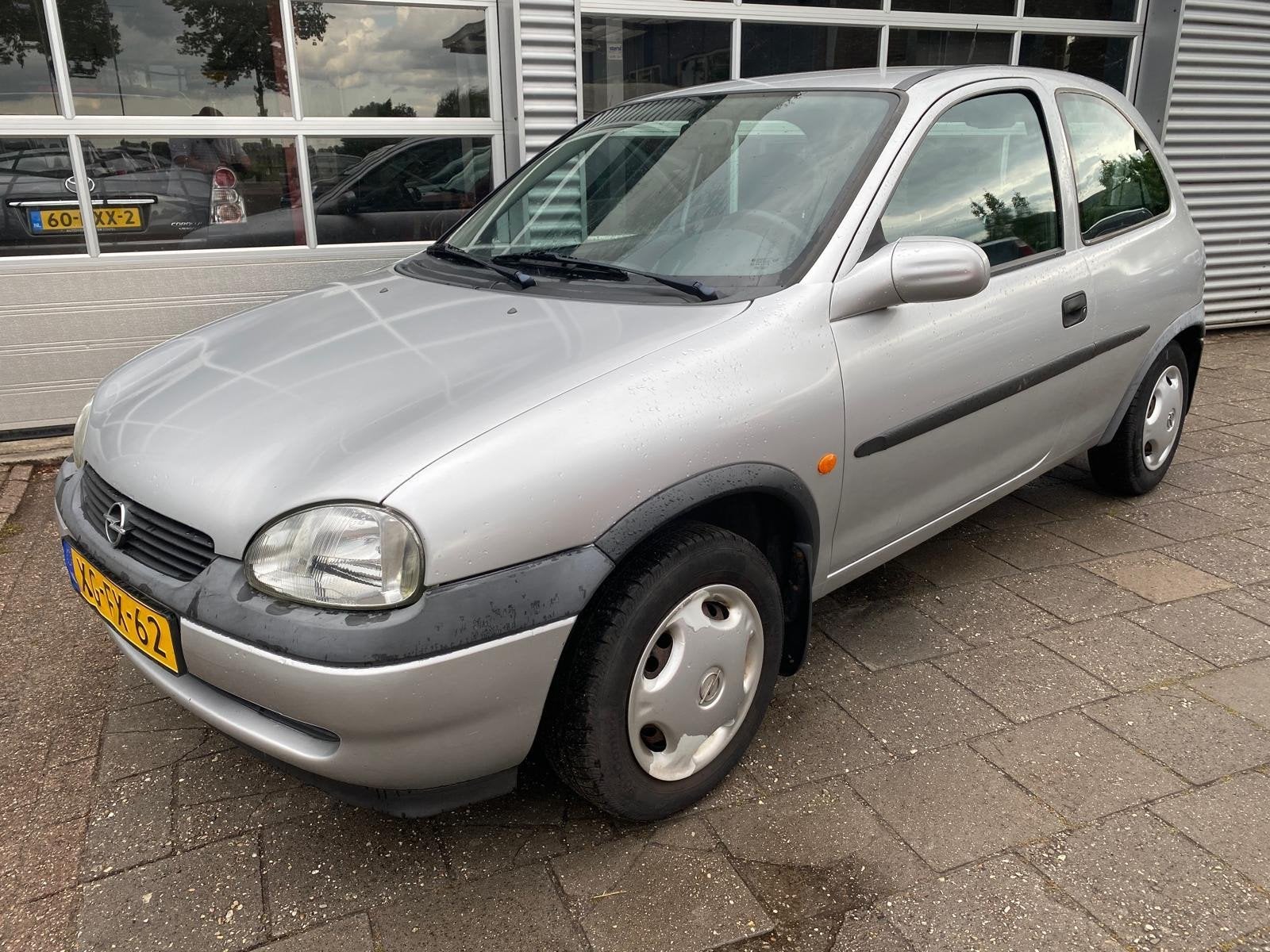 Opel Corsa 1.2i-16V Strada - Automaat - Stuurbekrachtiging, Auto's, Gebruikt, Origineel Nederlands, Bedrijf, Zilver of Grijs