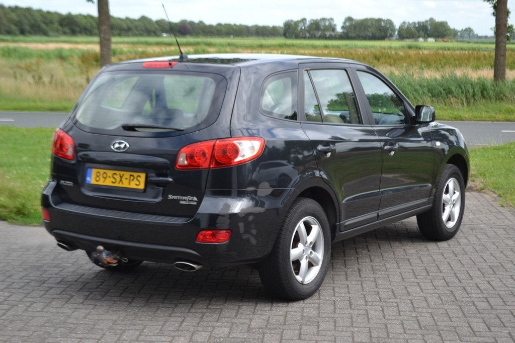 Hyundai Santa Fe 2.7i V6 Active Airco Trekhaak 2000 kg elekt, Auto's, Hyundai, Voorwielaandrijving, Gebruikt, 2000 kg, Zwart
