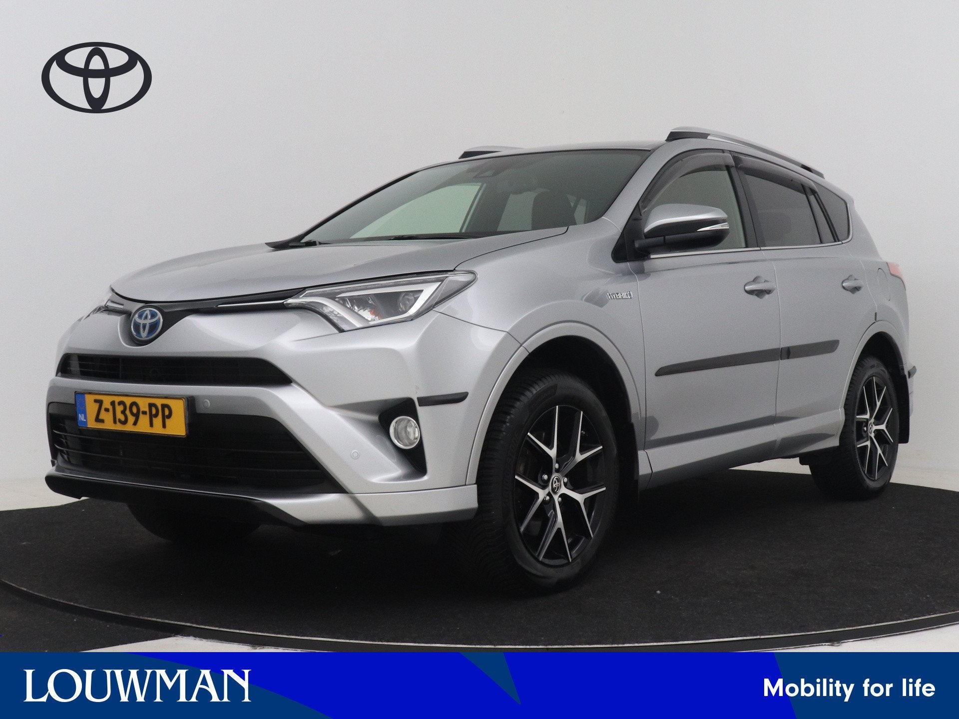 Toyota RAV4 2.5 Hybrid AWD Style | Dealer onderhouden | Rood