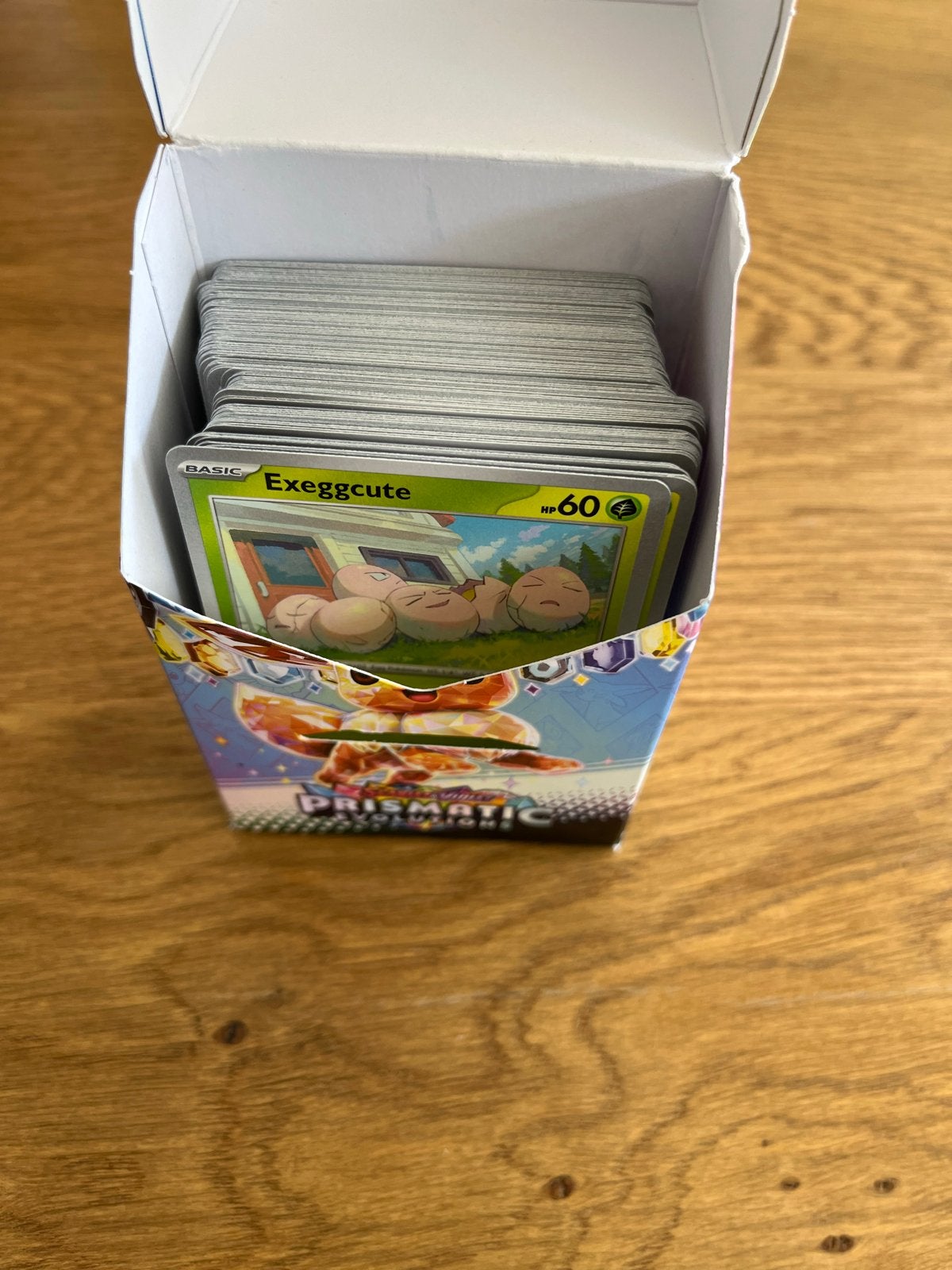 100+ Prismatic Evolutions pokemonkaarten, Ophalen of Verzenden, Zo goed als nieuw, Meerdere kaarten