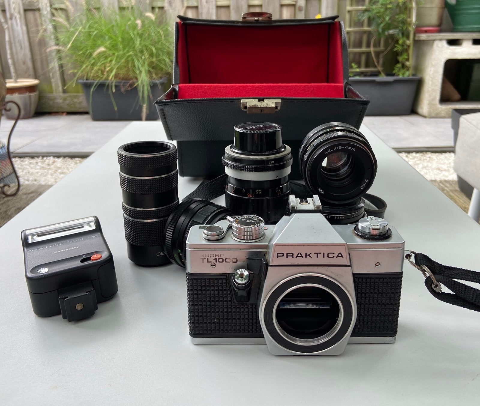 Praktica Super TL1000 + Lenzen + Flitser, Ophalen of Verzenden, Gebruikt, Spiegelreflex, Overige Merken