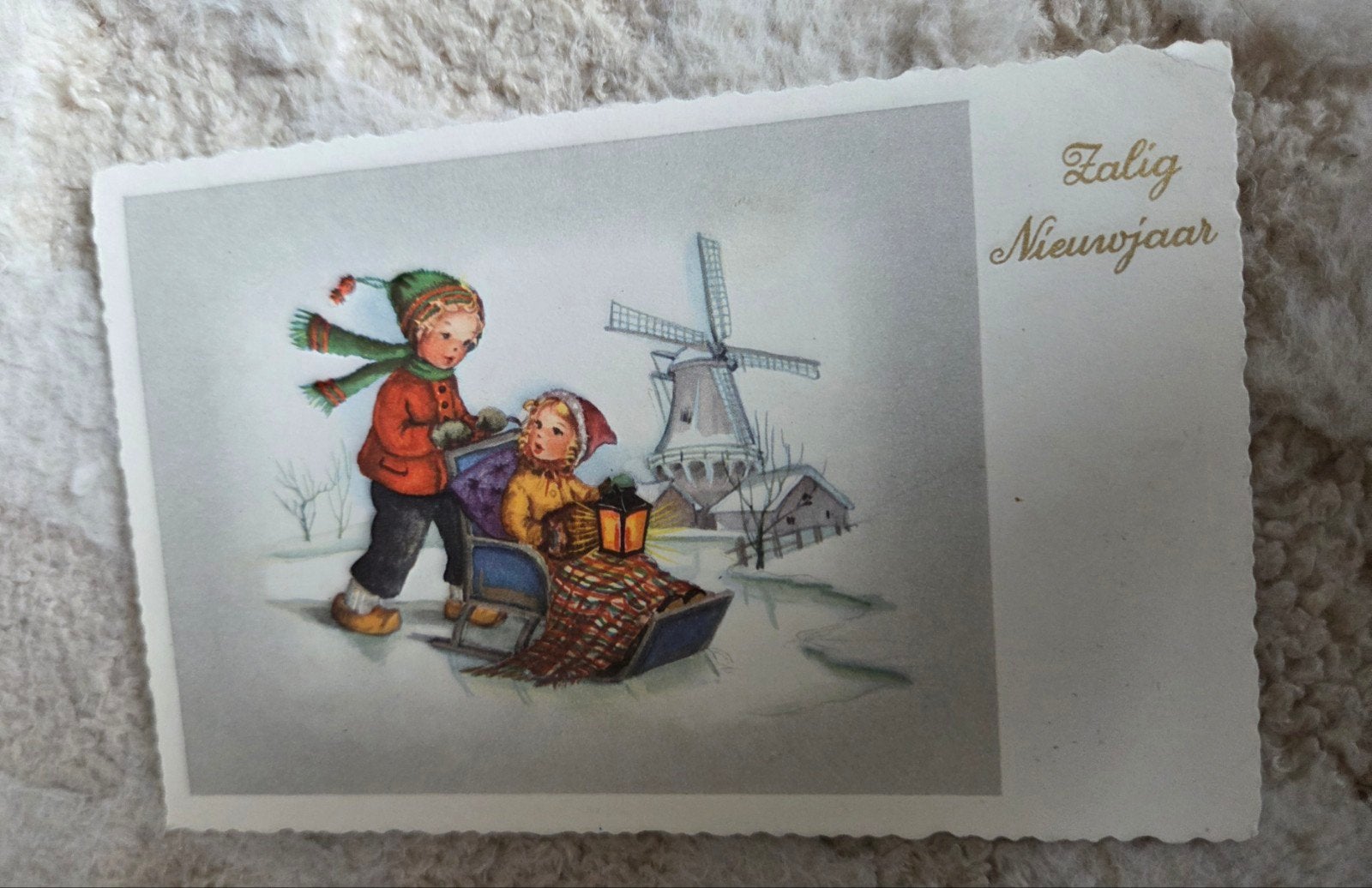 Vintage Nieuwjaarskaart met molen en schaatsende kinderen, Verzamelen, Verzenden, 1940 tot 1960, Gelopen, Feest(dag)