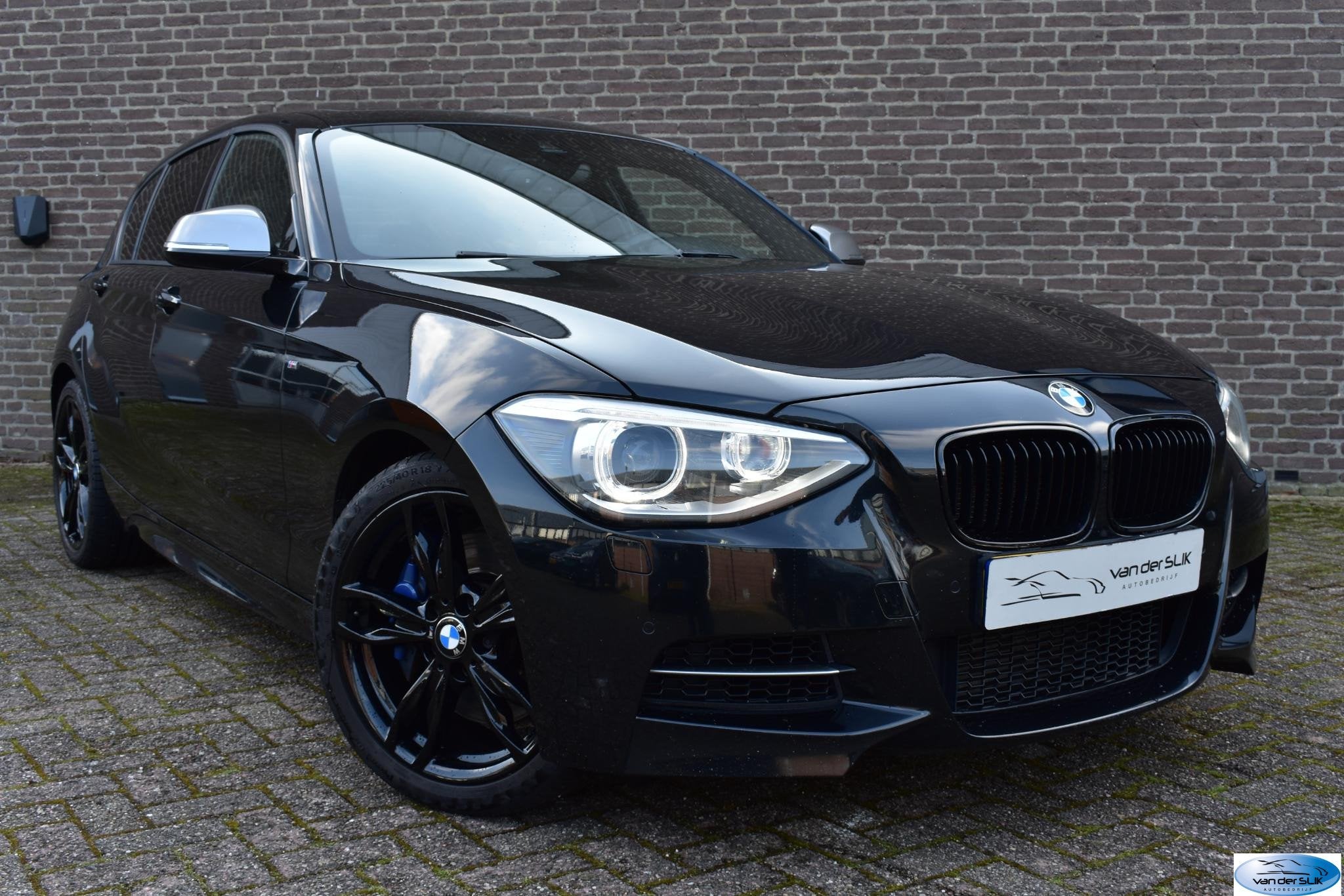 BMW 1-serie M135i xDrive High Executive Schuif / Kanteldak,, Gebruikt, Euro 6, 320 pk, Zwart