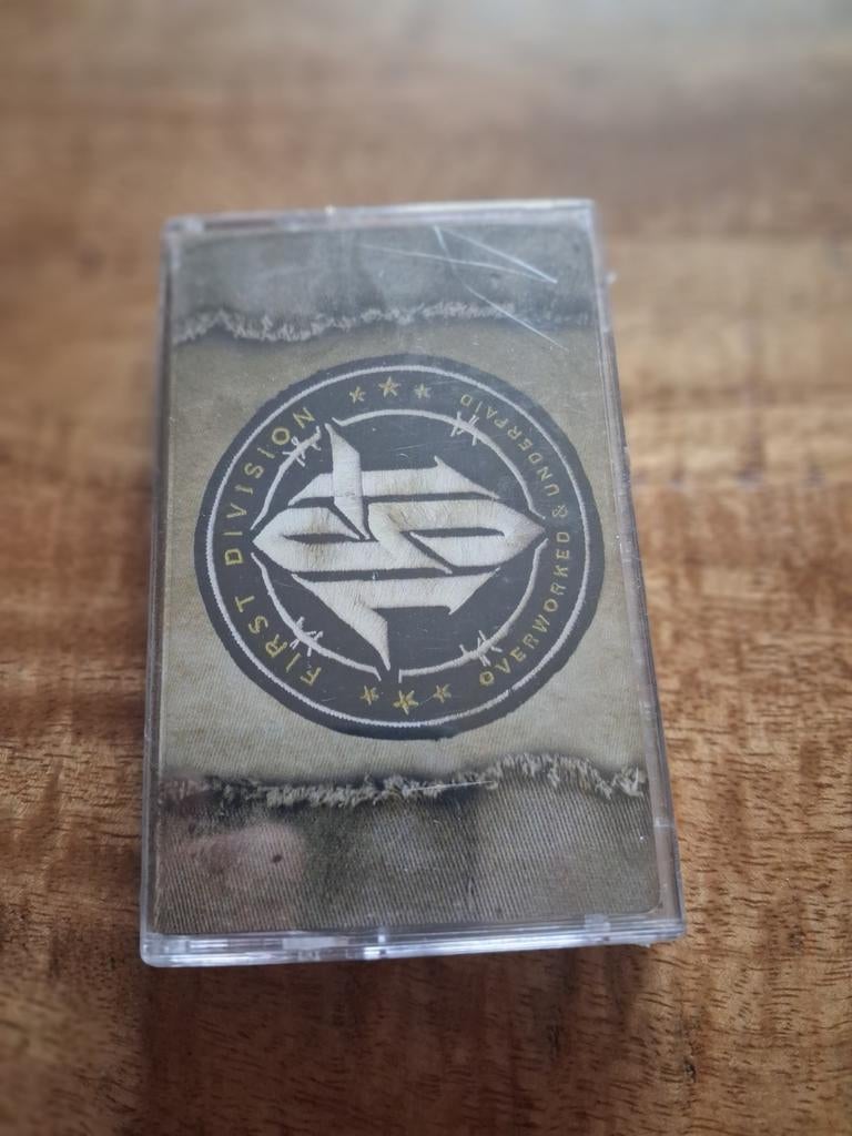 First Division - Overworked & Underpaid Cassette, Cd's en Dvd's, Cassettebandjes, 1 bandje, Ophalen of Verzenden, Origineel, Nieuw in verpakking