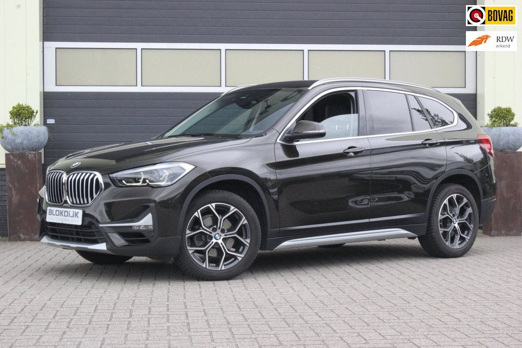 BMW X1 1.8i sDrive xLine | Camera | ACC |, Gebruikt, Zwart, Bruin, Leder en Stof