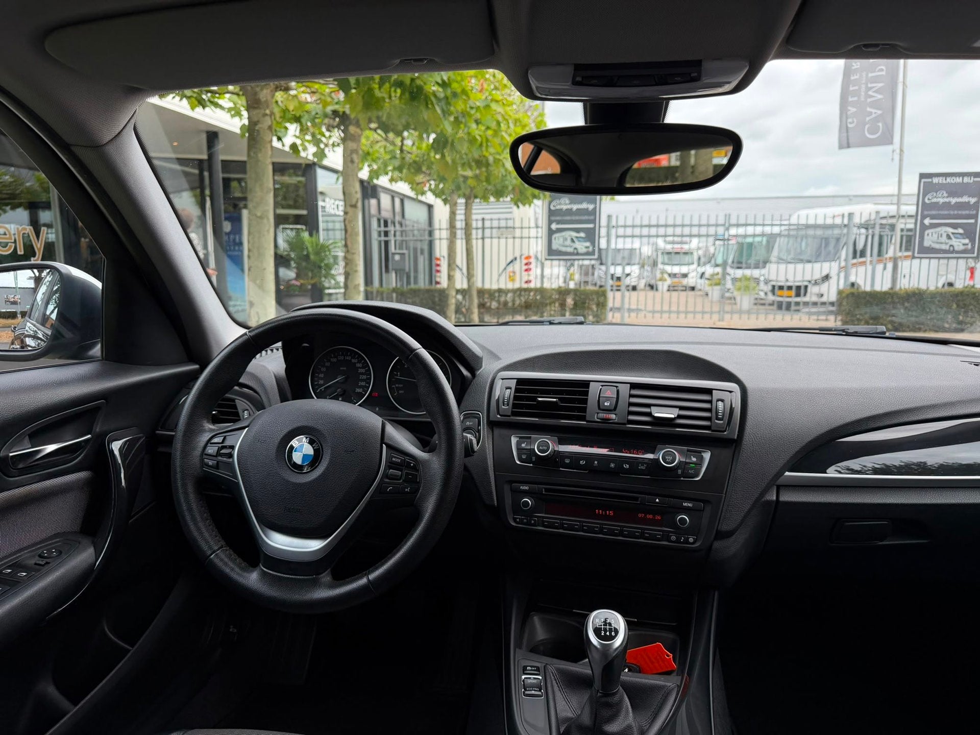 BMW 1-serie 116i l AIRCO l PDC l MULTISTUUR, 1-Serie, 4 cilinders, Cruise Control, Zwart