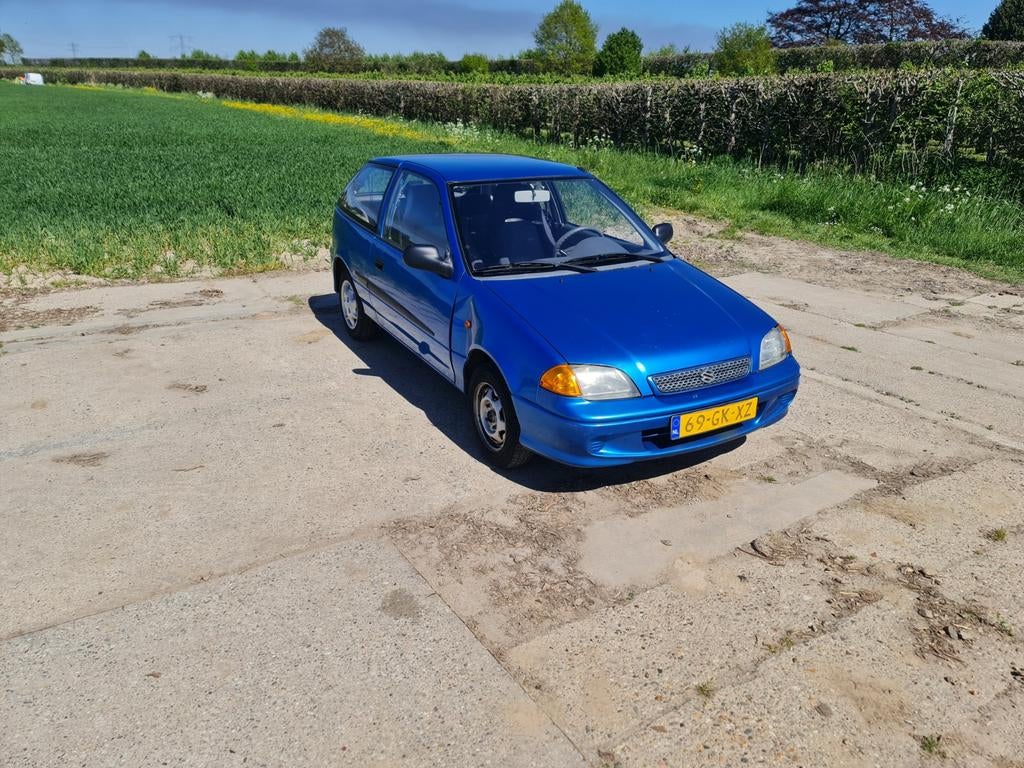 Suzuki Swift 1.3 AUT 2001 Blauw, Auto's, Suzuki, Stof, 785 kg, 4 cilinders, Blauw