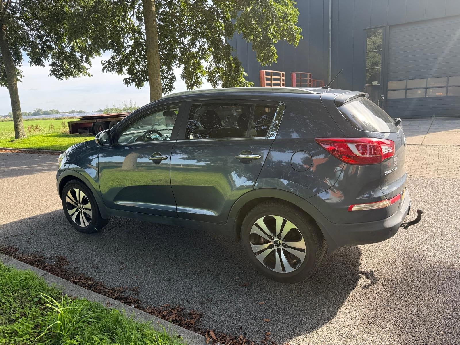 Kia Sportage 2.0 Comfort Pack AWD AUTOMAAT, Auto's, Gebruikt, 4 cilinders, Blauw, 163 pk