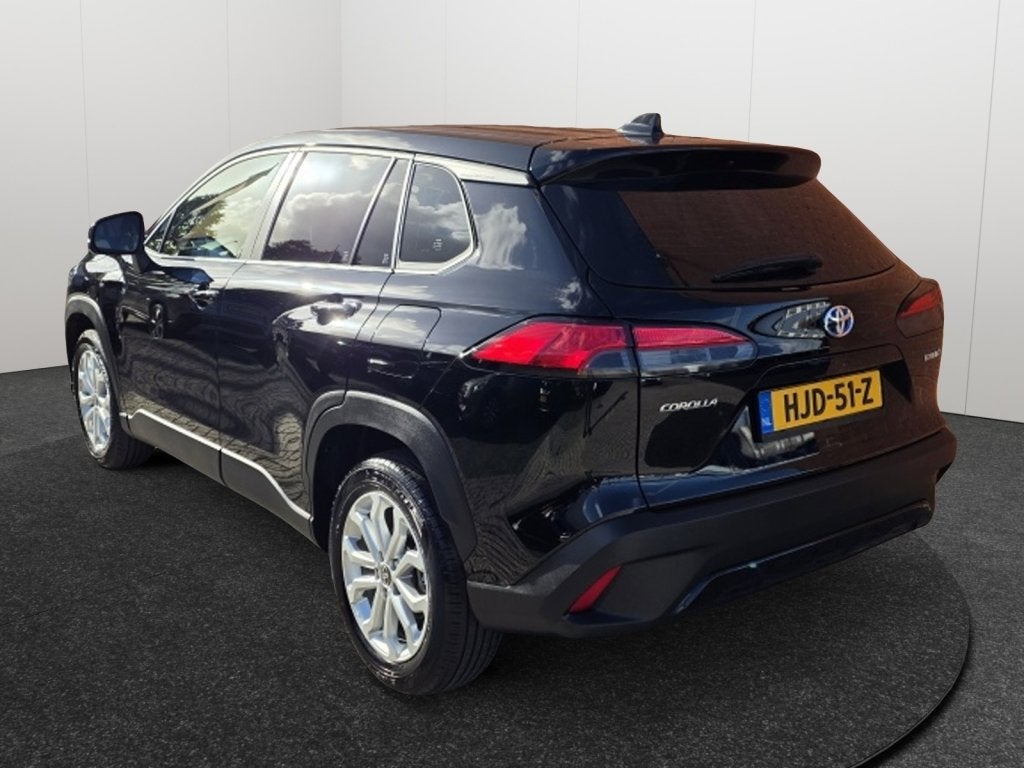 Toyota Corolla Cross Hybrid 140 Dynamic Clima Camera Velgen, Auto's, Stof, Gebruikt, Zwart, Bedrijf
