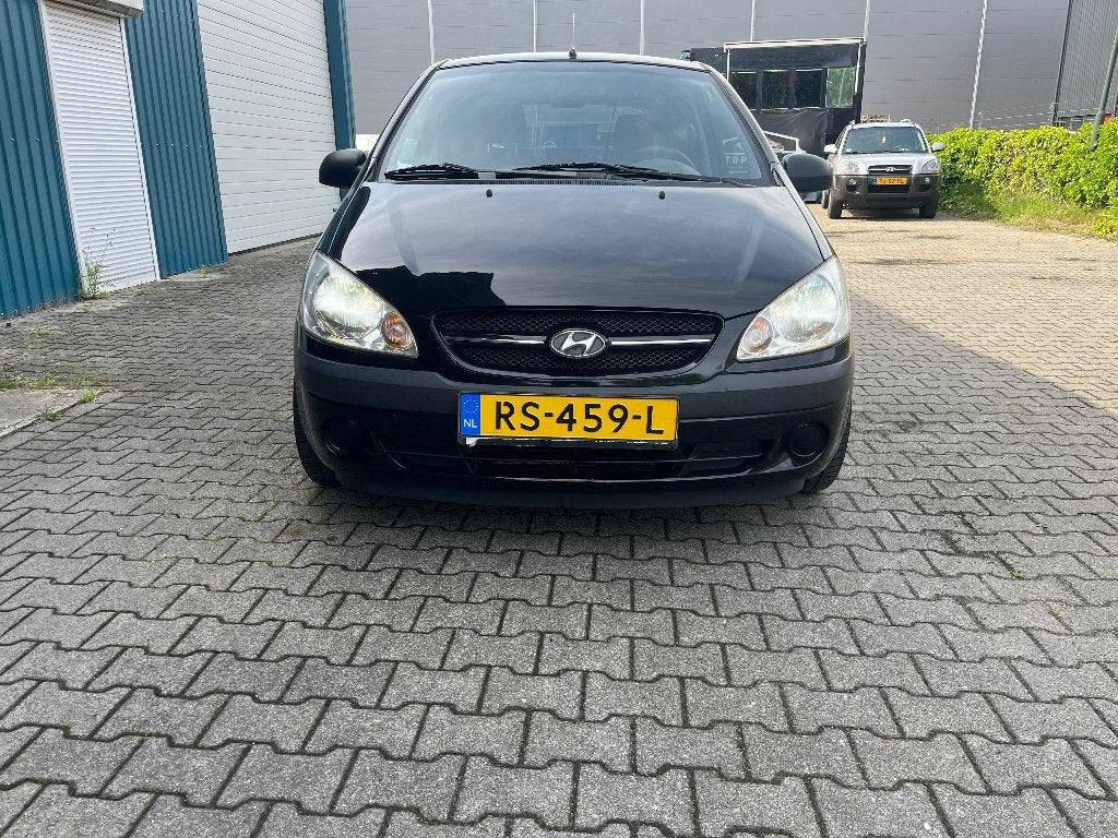 Hyundai Getz 1.1 5DRS 2007 Zwart, Auto's, Hyundai, Voorwielaandrijving, 31 €/maand, 4 cilinders, Handgeschakeld