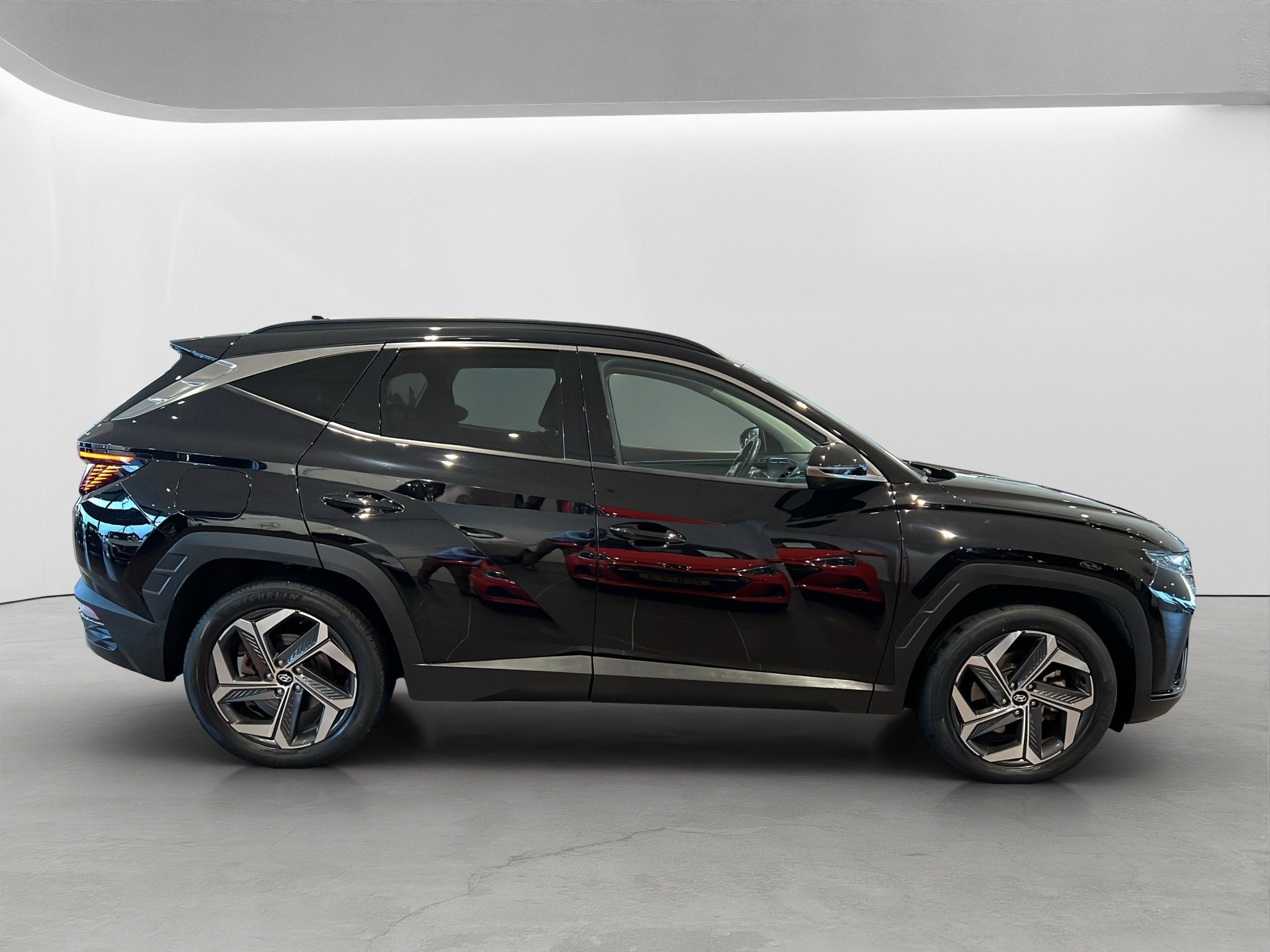Hyundai Tucson 1.6 T-GDI 265pk PHEV Premium 4WD, Auto's, Hyundai, Gebruikt, 4 cilinders, Zwart, Bedrijf