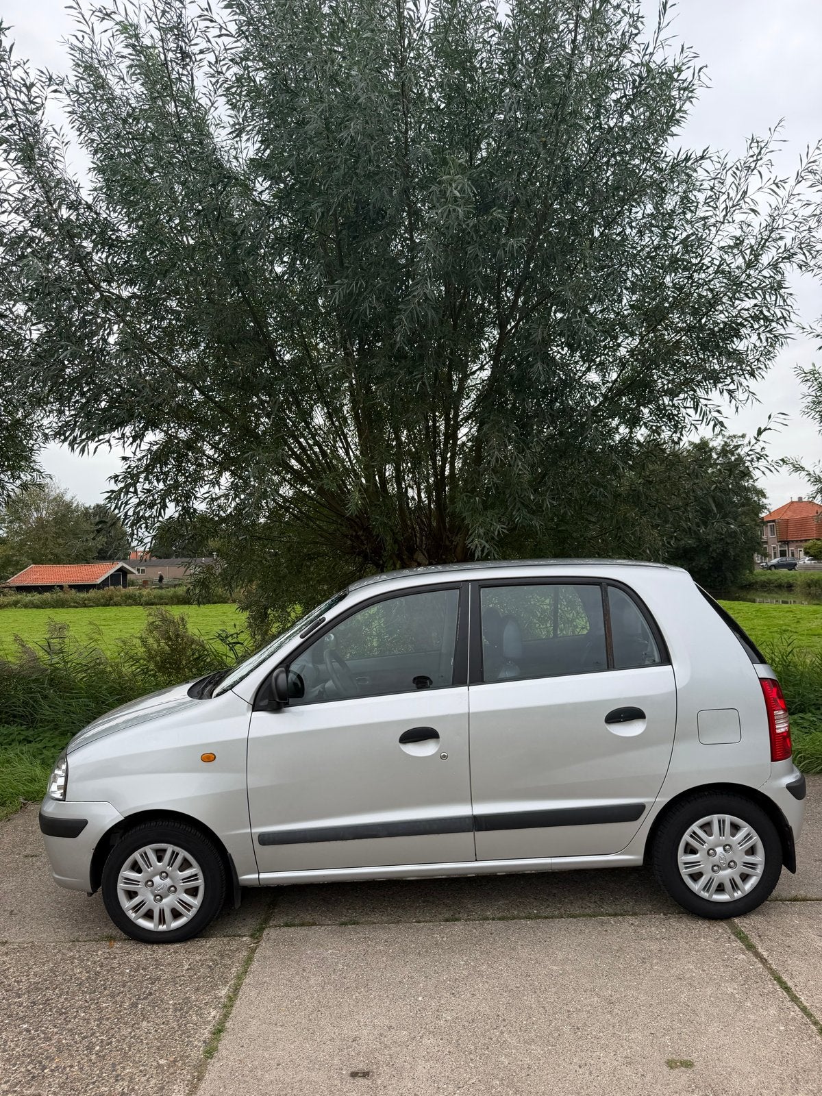 Hyundai Atos 1.1 2006 Grijs, Auto's, Voorwielaandrijving, 31 €/maand, 4 cilinders, Particulier