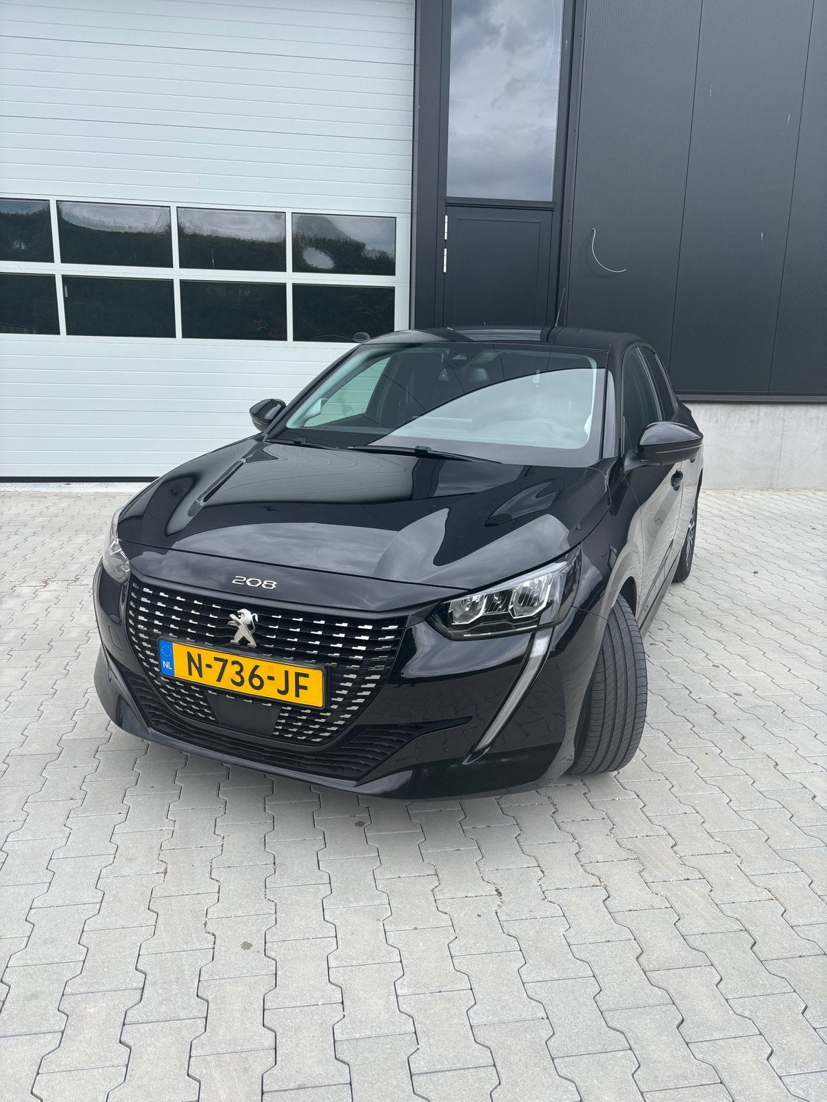 Peugeot 208 1.2 Puretech 100pk 2021 Zwart, Auto's, 101 pk, Zwart, Leder en Stof, Origineel Nederlands
