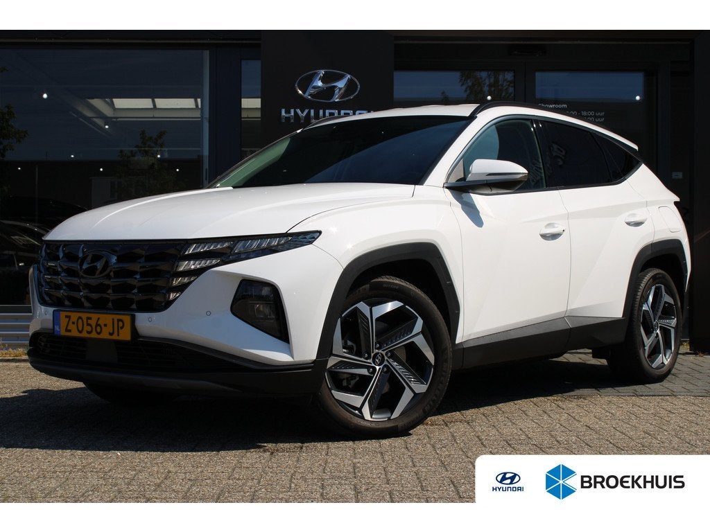 Hyundai TUCSON 1.6 T-GDI PHEV Comfort Smart 4WD PHEV 265pk 4, Auto's, Stof, Gebruikt, 4 cilinders, Wit