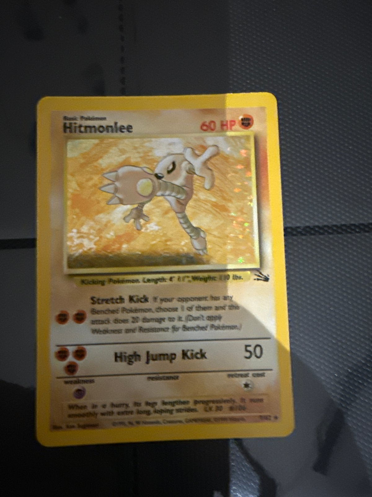 Pokémon Hitmonlee Fossil Holo 1999, Ophalen of Verzenden, Gebruikt, Losse kaart, Foil